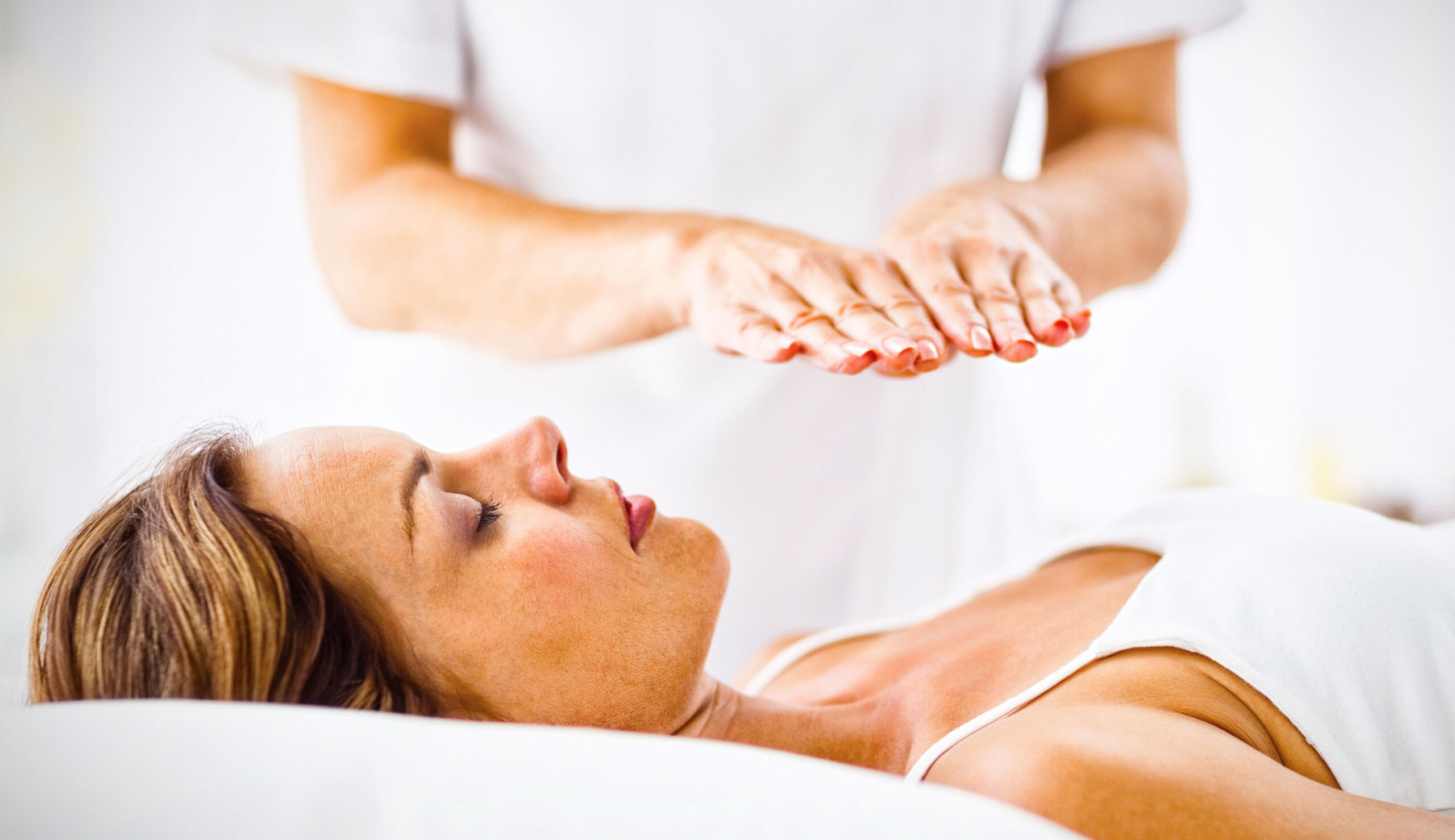 Woman reciving reiki Woman reciving reiki